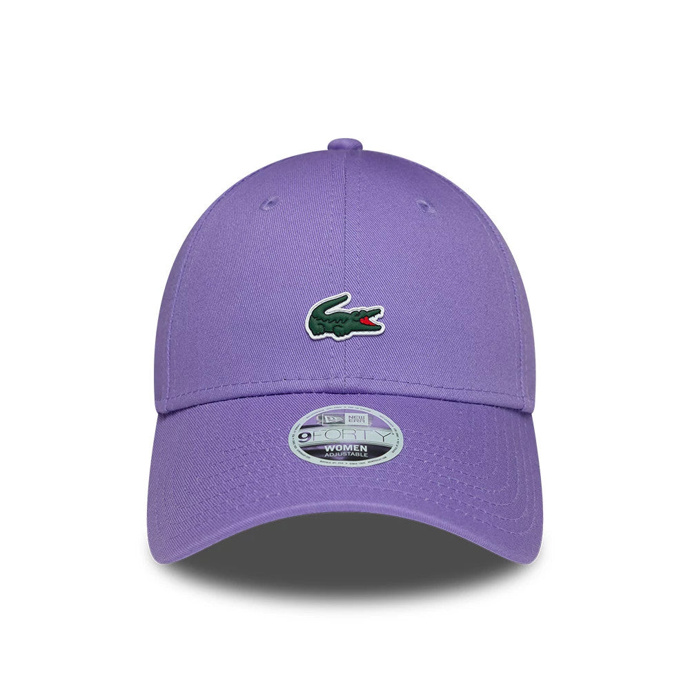 Womens Lacoste X New Era Purple 9FORTY Adjustable Cap, front view showing the green embroidered Lacoste crocodile logo on the structured purple crown, a curved purple visor, and the 9FORTY size sticker at the centre.