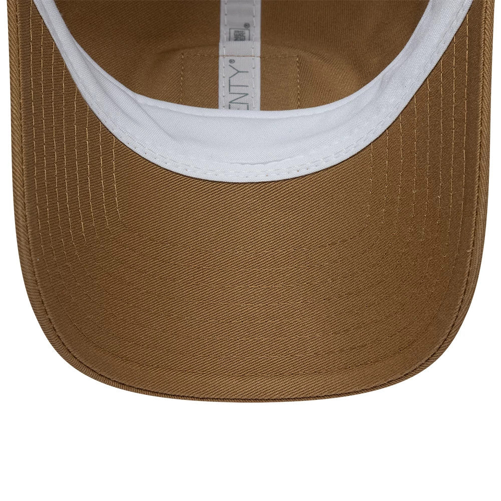 Lacoste X New Era Beige 9TWENTY Adjustable Cap, inside view showing a white sweatband around the base of the beige crown, white New Era taping along the cap’s centre seam, and the underside of the curved beige visor.
