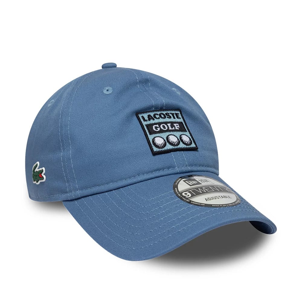 Pictured is this Lacoste X New Era 9TWENTY cap in blue. 1