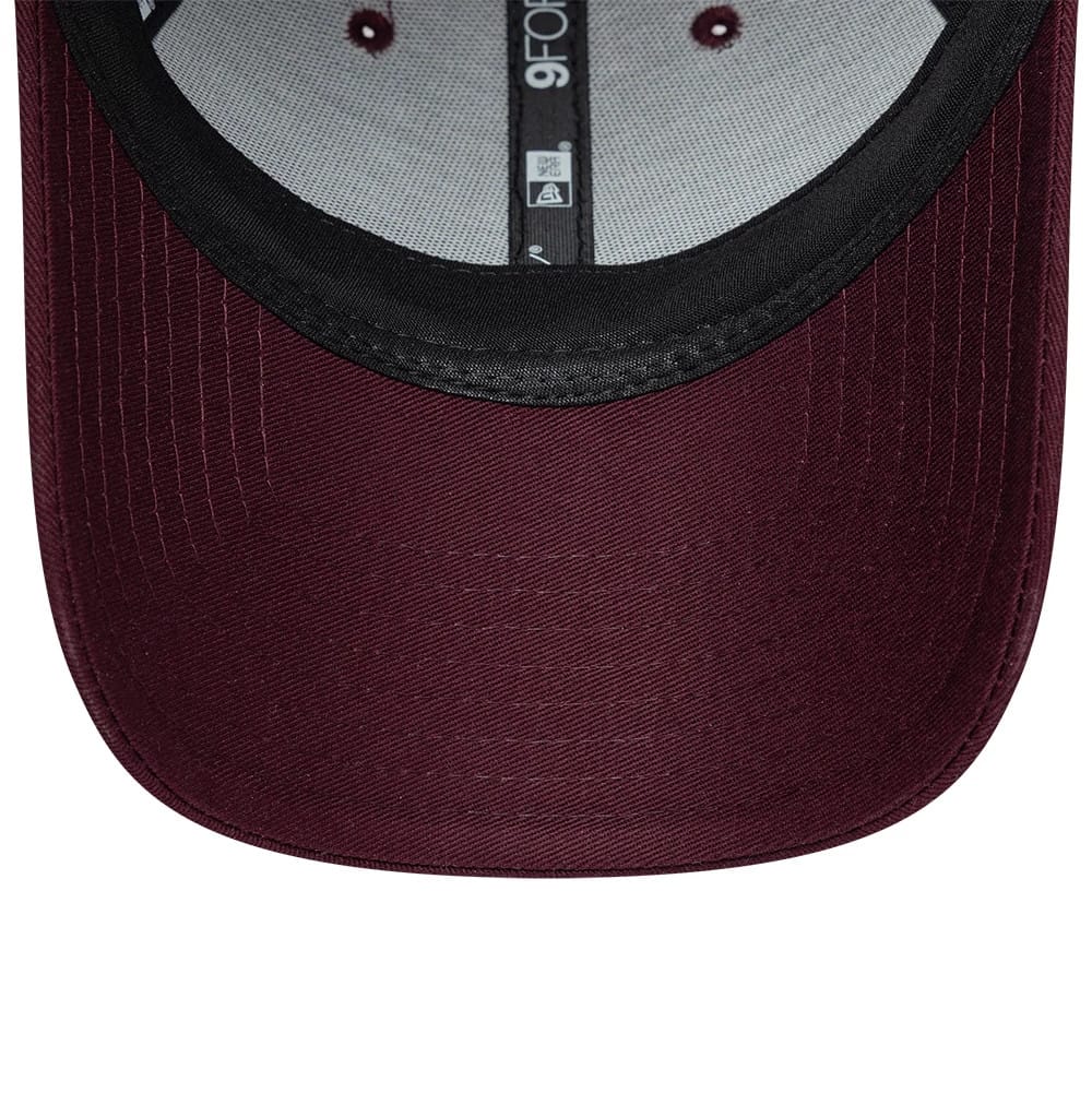 Womens Lacoste X New Era Dark Purple 9FORTY Adjustable Cap, inside view revealing the structured black sweatband, grey internal taping with 9FORTY branding, and a maroon undervisor with stitch lines across the curved edge.