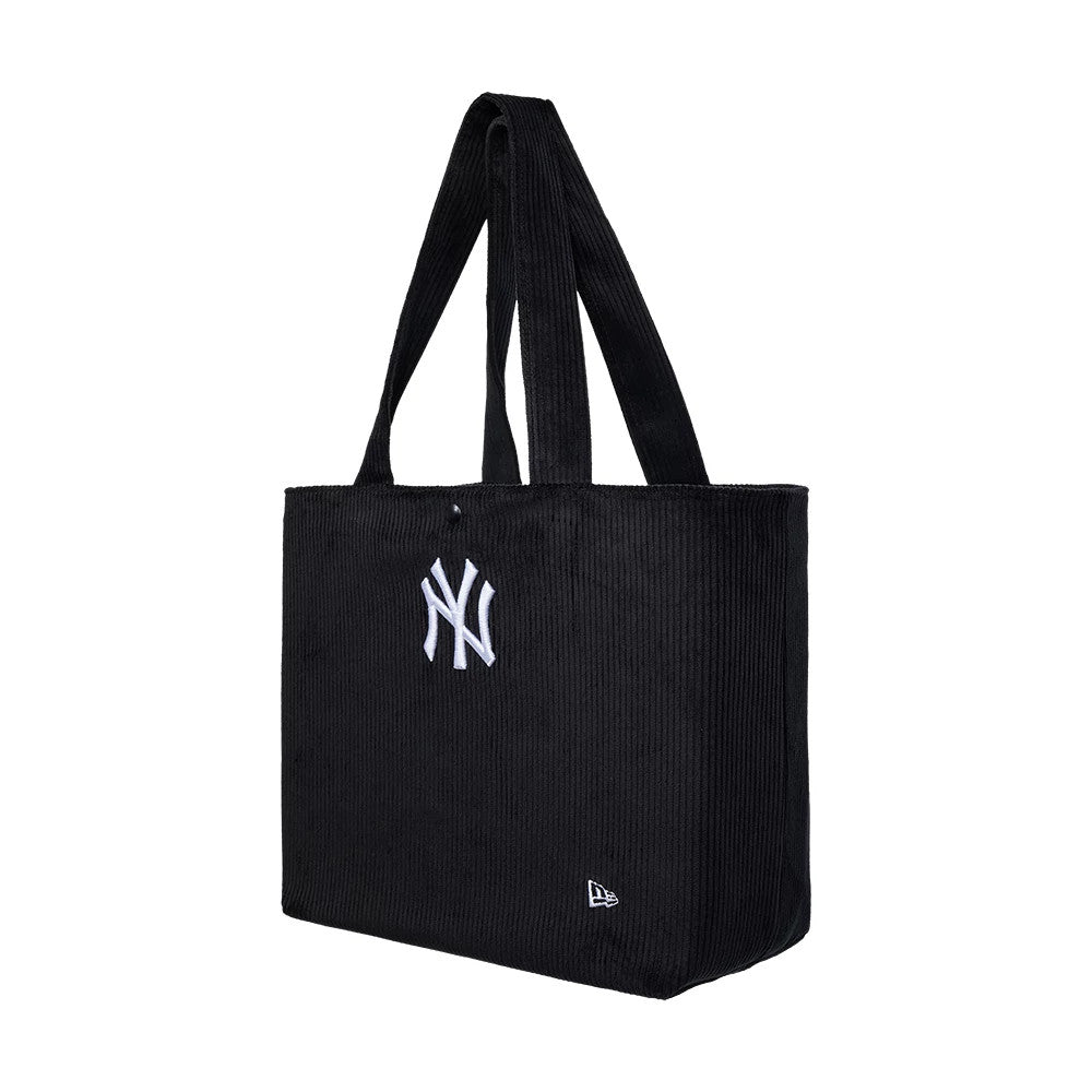 New Era New York Yankees MLB Chunky Cord Black Tote Bag, three-quarter view showing the tote's textured black surface with long handles, a raised white Yankees logo centred on the front.