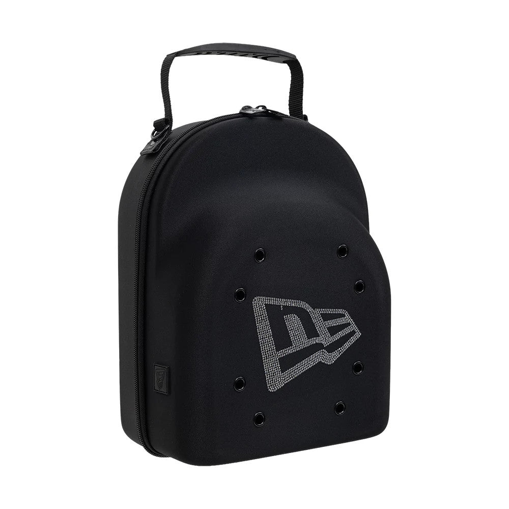 New Era Rhinestone Black 6Pk 59FIFTY Cap Carrier, three-quarter view showing a black shell with a zip closure along the side, a carry handle on top, and an eye-catching rhinestone-embellished New Era logo on the front.