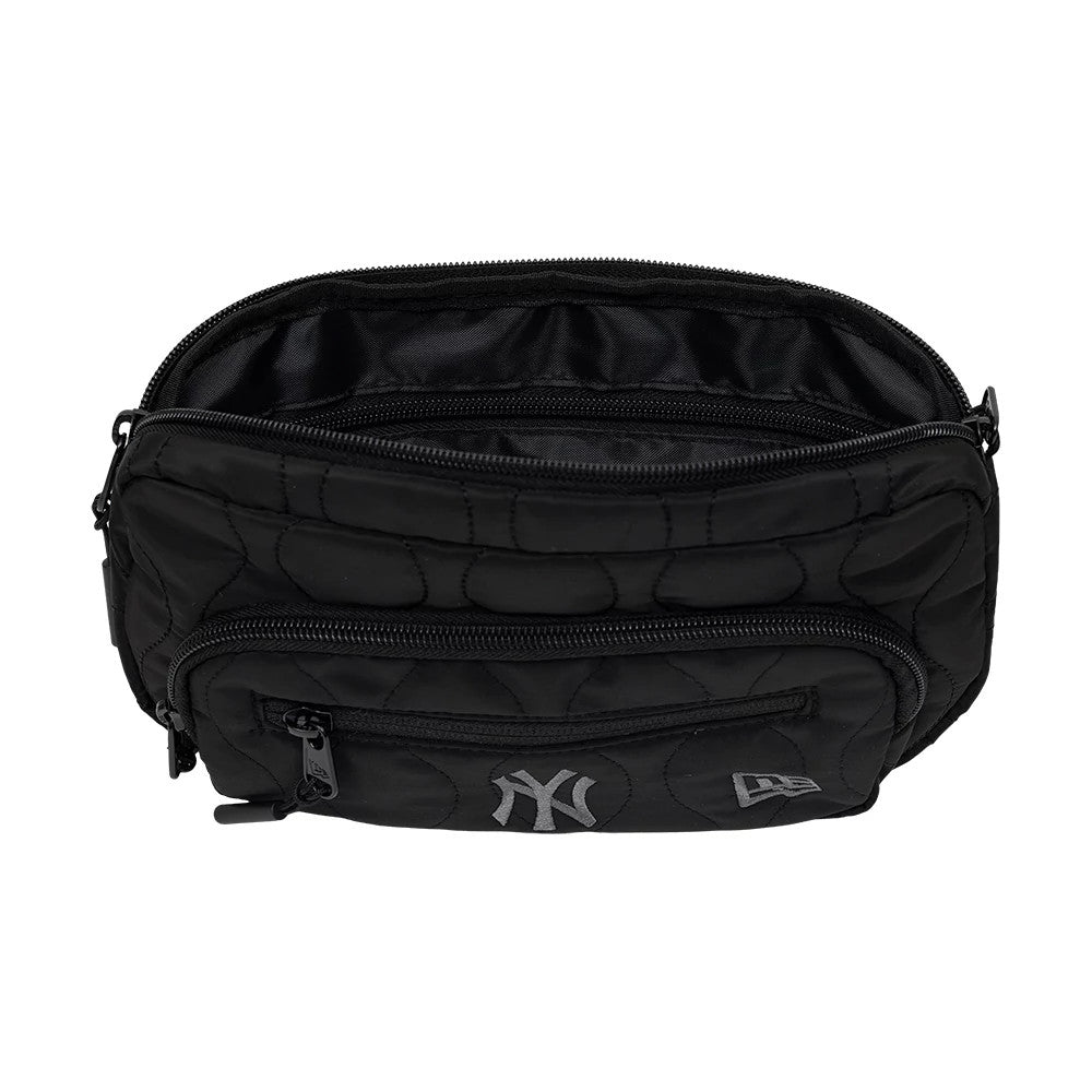 New Era New York Yankees MLB Black Padded Utility Waist Bag, open view showing the interior with multiple compartments, a front zip pocket, raised Yankees logo centred below the zip.