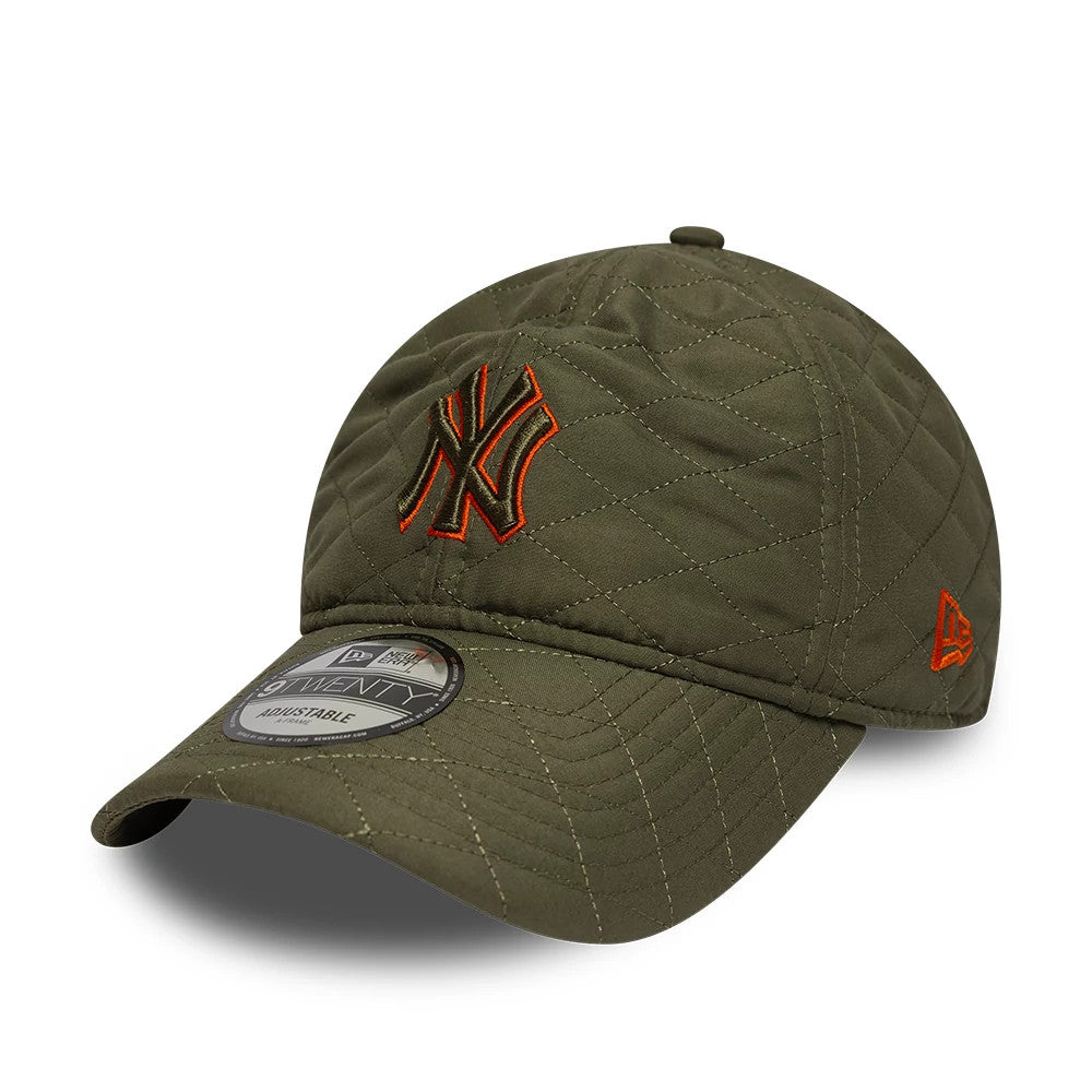 New York Yankees MLB Padded Outline Green New Era 9TWENTY Adjustable Cap, front view showing the orange-outlined NY logo embroidered on the green quilted crown, with an orange New Era flag logo on the left side.