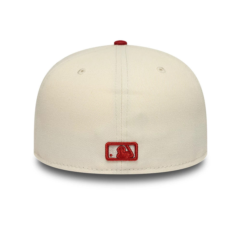 New York Yankees MLB League Essential Cream & Red New Era 59FIFTY Fitted Cap, rear view showing the red embroidered MLB Batterman logo at the centre of the cream back panels, with a matching red top button and cream eyelets.