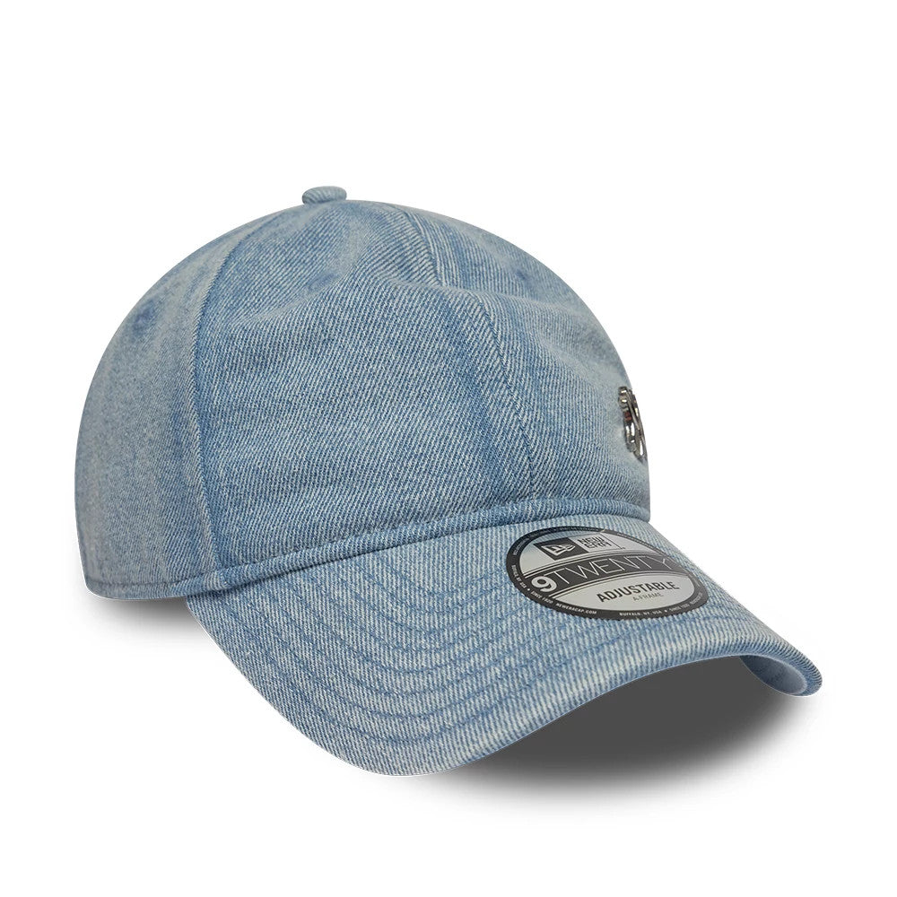 New York Yankees MLB Washed Denim Pastel Blue New Era 9TWENTY Adjustable Cap, three-quarter view showing the black and white embroidered Yankees logo on the front panel, the curved visor with a 9TWENTY size sticker.