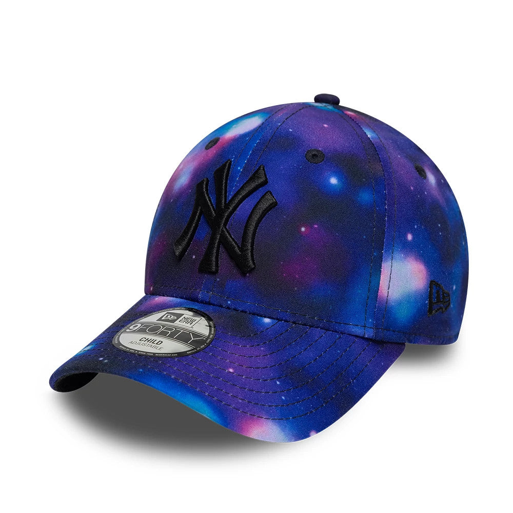 New York Yankees Child MLB All Over Print Black New Era 9FORTY Adjustable Cap, front view showing the black embroidered NY logo on the front panel, space-themed galaxy print throughout the crown, and the 9FORTY size sticker on the curved visor.