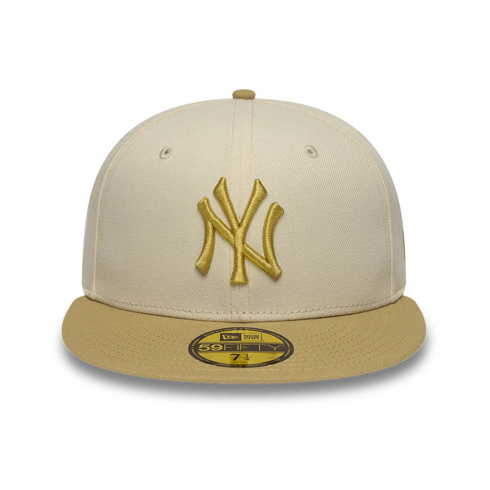 New York Yankees MLB League Essential Cream & Gold New Era 59FIFTY Fitted Cap, front view showing the gold embroidered Yankees logo on the cream structured crown, with a contrasting gold visor and a gold 59FIFTY size sticker on the visor.