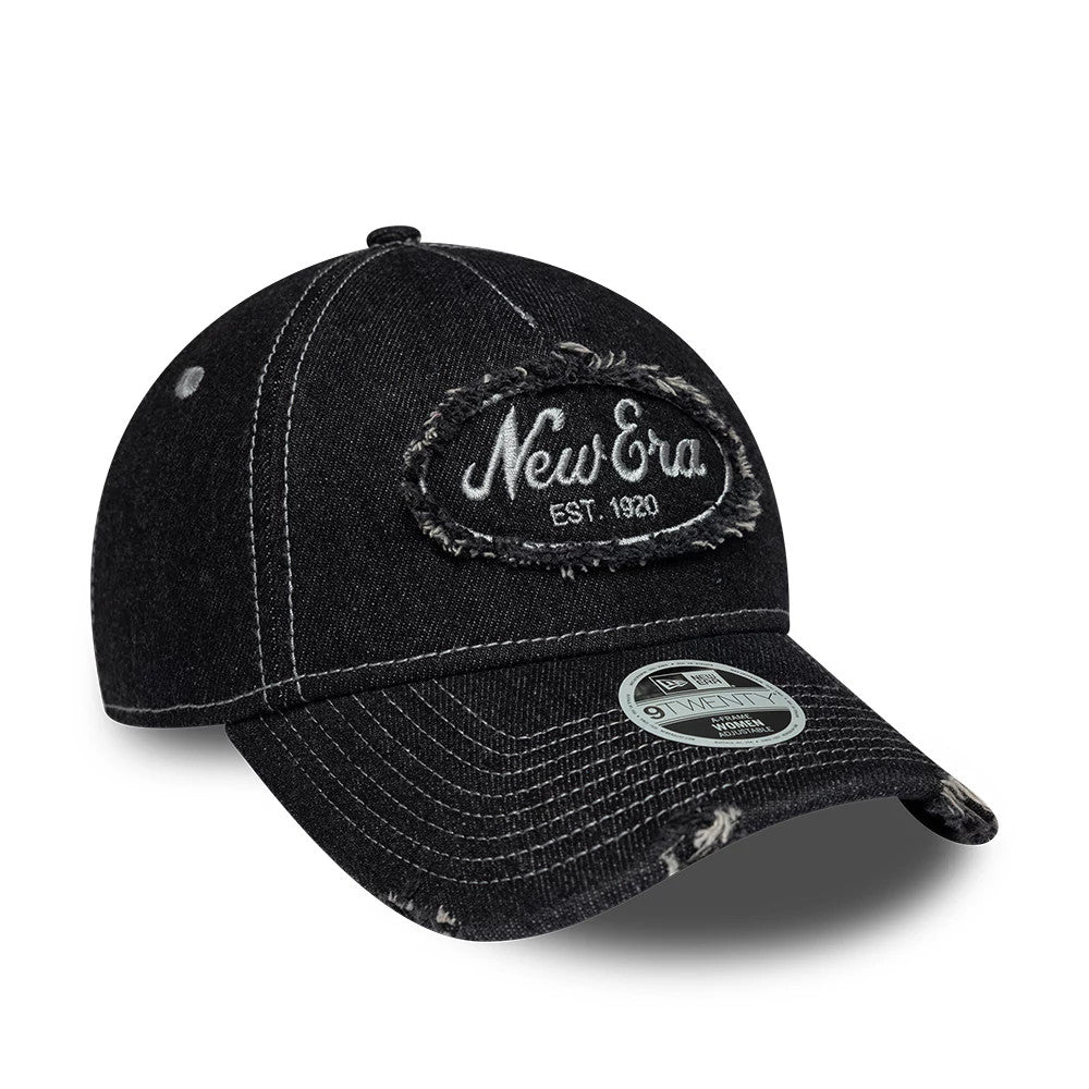Womens New Era Distress Black 9TWENTY A-Frame Adjustable Cap, front view showing the white embroidered New Era logo on a distressed black fabric patch, a curved visor with distress marks, and a 9TWENTY size sticker on the visor.