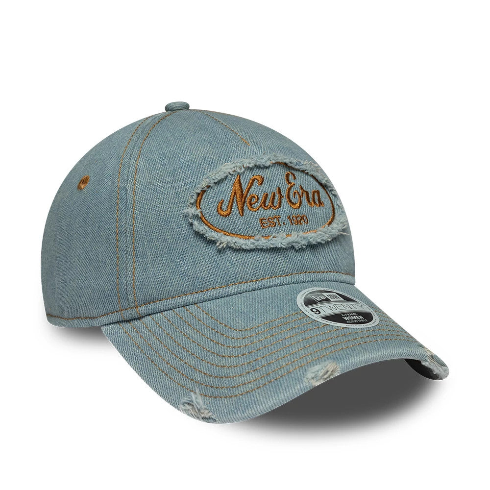 Womens New Era Distress Pastel Blue 9TWENTY A-Frame Adjustable Cap, three-quarter view showing the large distressed New Era Est. 1920 logo patch in tan embroidery on the front, with a curved visor and 9TWENTY size sticker.