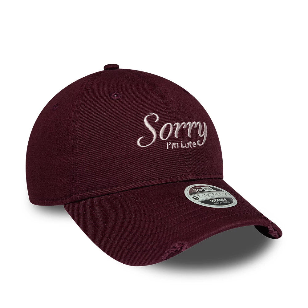 Womens New Era Slogan Dark Purple 9TWENTY Adjustable Cap, front view showing the white embroidered Sorry I'm Late slogan on the structured crown, with a curved visor and a 9TWENTY size sticker on the dark purple fabric.