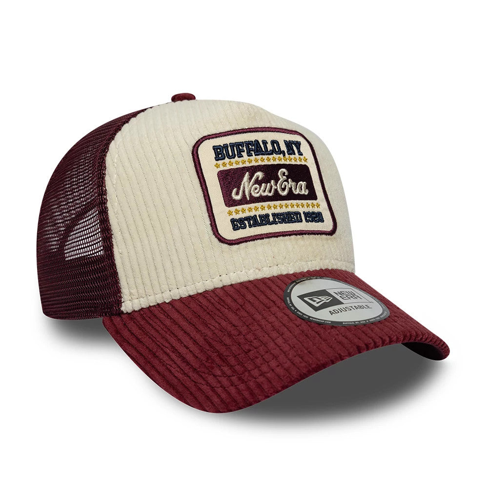 New Era Cord Visor Dark Purple 9FORTY E-Frame Trucker Adjustable Cap, front three-quarter view showing a cream crown with embroidered Buffalo, NY New Era patch, dark mesh side panels, and a dark purple corduroy visor with a 9FORTY size sticker.