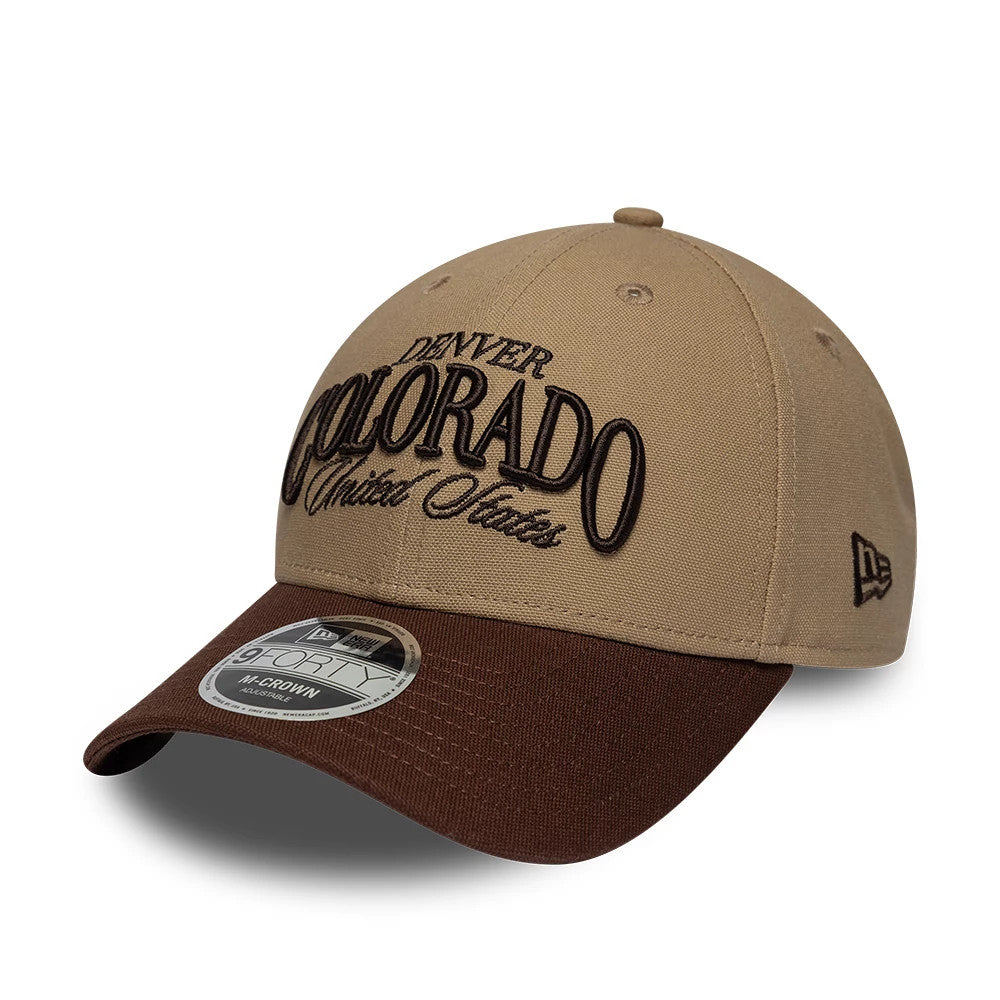 Pictured is this New Era Colorado 9FORTY M-Crown cap in beige & brown. 1