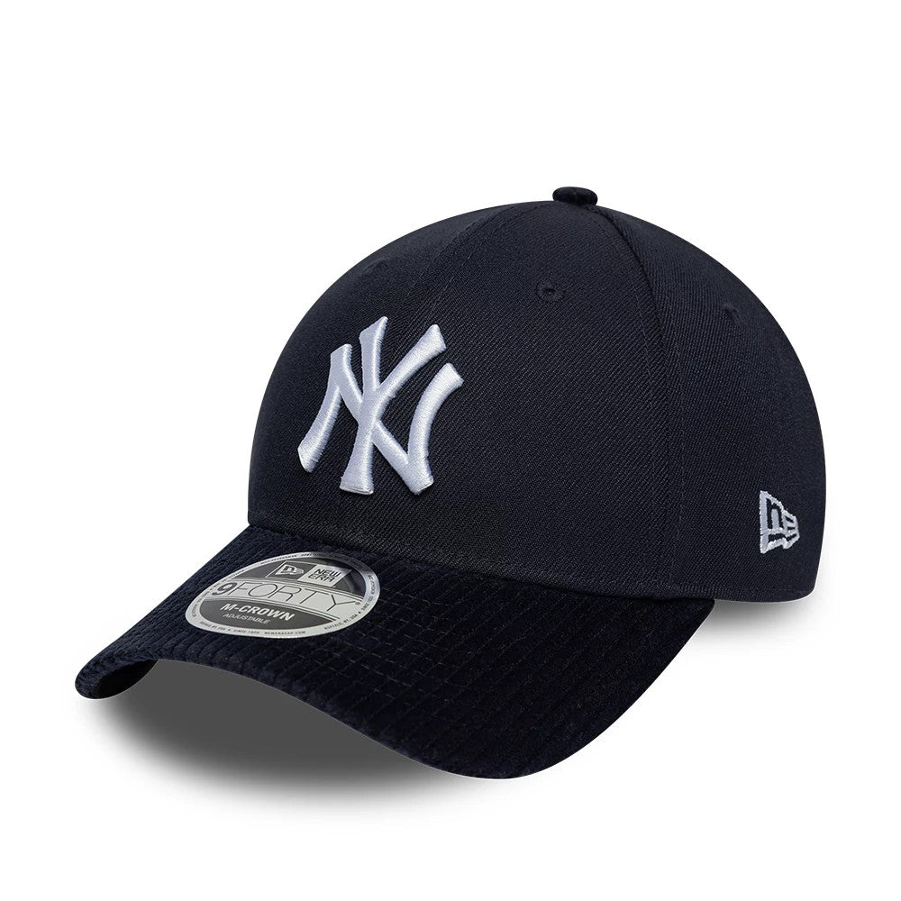 New York Yankees MLB Cord Visor Navy New Era 9FORTY M-Crown Adjustable Cap, three-quarter view showing the raised white NY logo embroidered on the front panel, black corduroy curved visor, and 9FORTY size sticker on the top.