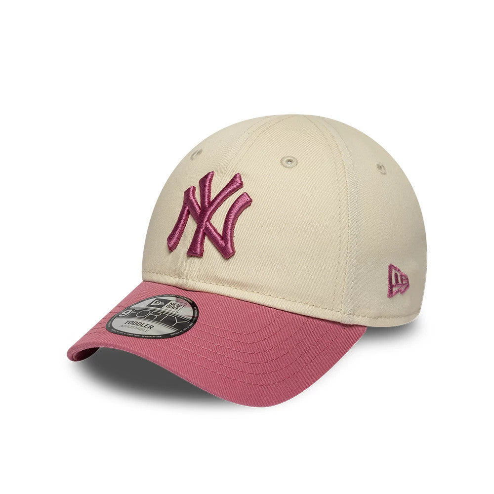 Yankees Toddler MLB League Essential Light Beige New Era 9FORTY Adjustable Cap, front view showing the raised pink embroidered NY logo on the light beige front panels, with a contrasting pink curved visor and a 9FORTY size sticker.