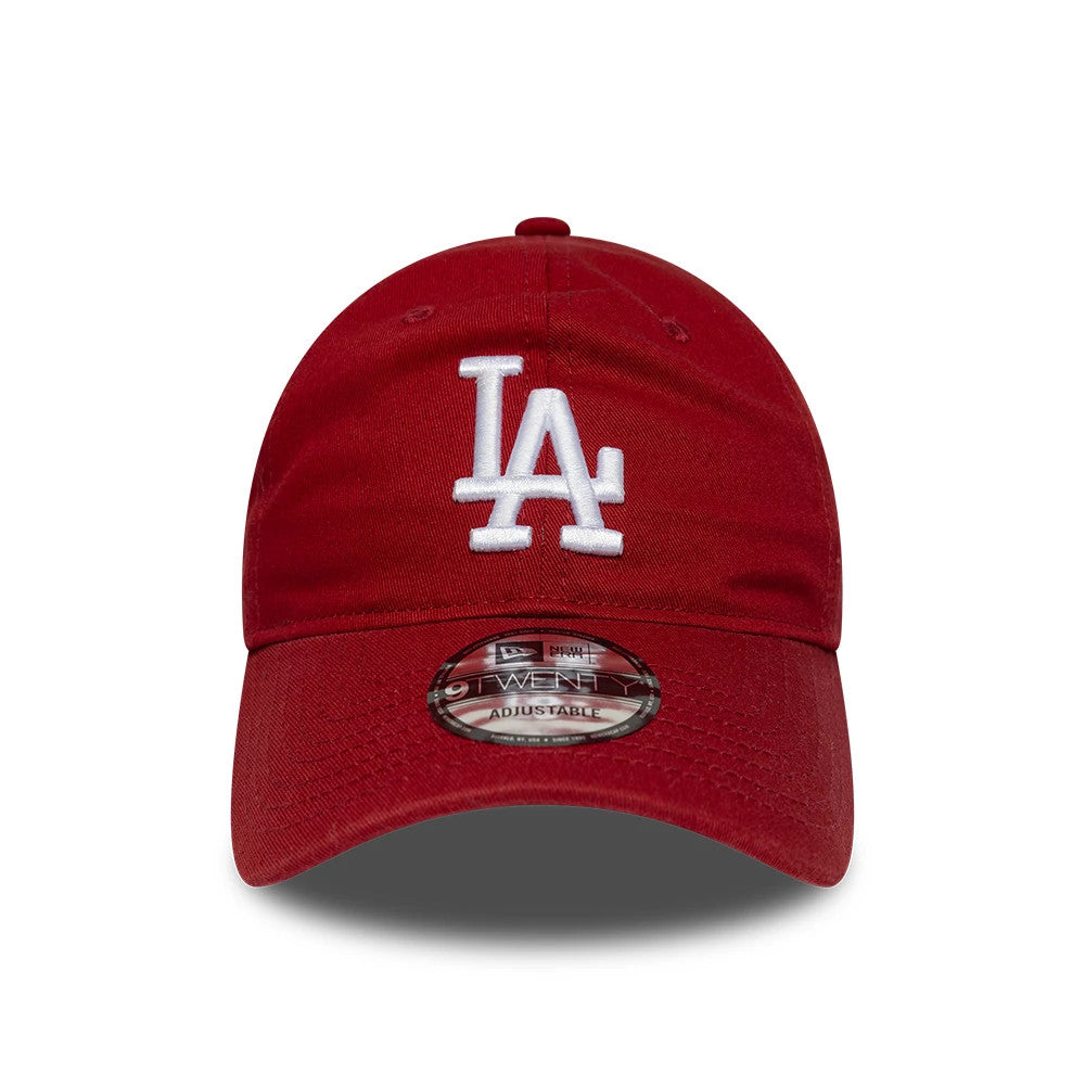 LA Dodgers MLB League Essential Dark Red New Era 9TWENTY Adjustable Cap, front view showing a white embroidered LA logo prominently on the unstructured crown, with a curved visor featuring a 9TWENTY size sticker centrally placed.