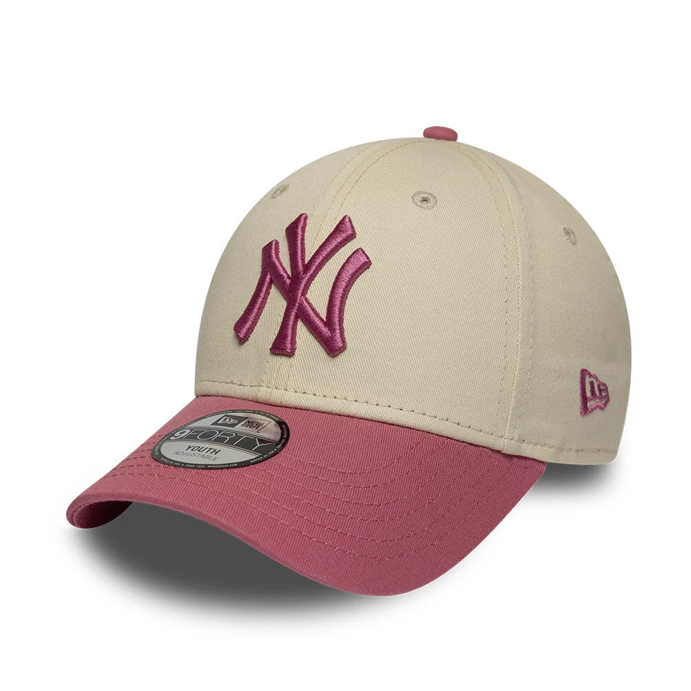 Yankees Youth MLB League Essential Light Beige & Pink New Era 9FORTY Adjustable Cap, front view showing the raised pink New York Yankees logo embroidered on the light beige crown with a contrasting pink visor and 9FORTY size sticker.