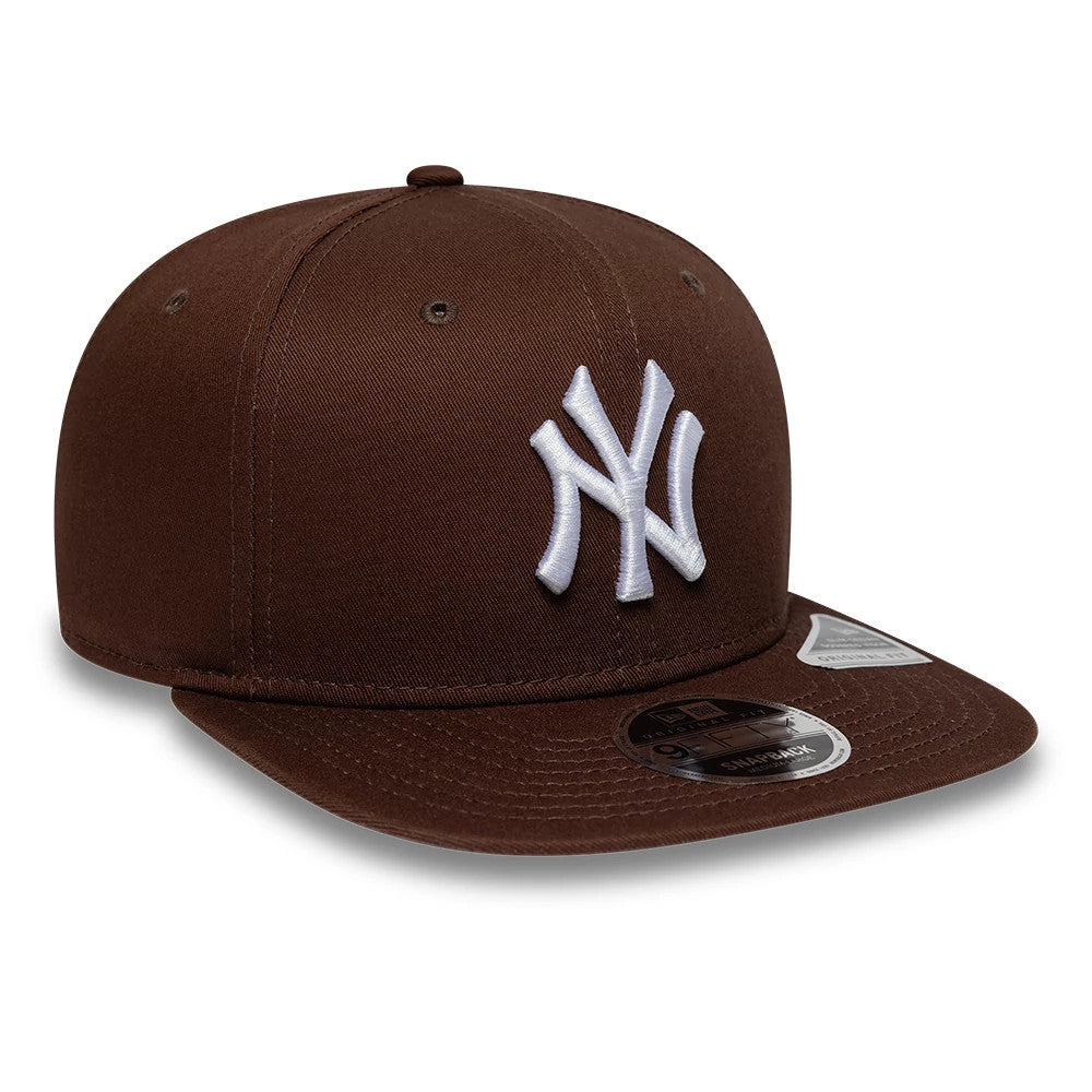 Yankees MLB League Essential Brown New Era 9FIFTY Original Fit Snapback Adjustable Cap, three-quarter view showing the white embroidered NY logo on the front panel, brown flat visor with a 9FIFTY size sticker, and top button matching the brown crown.