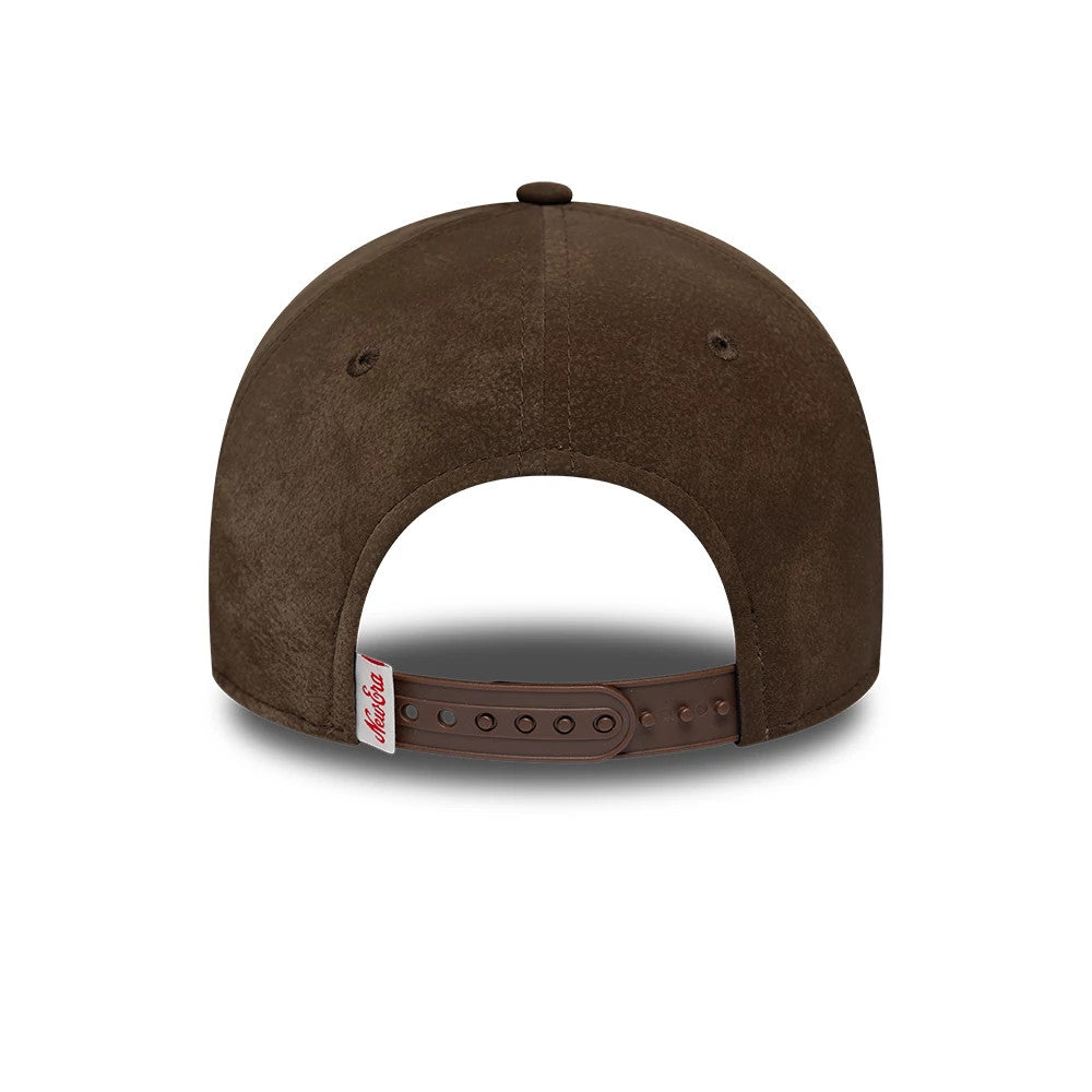 New Era Moto Patch PU Brown New Era 9FORTY E-Frame Adjustable Cap, rear view showing a red and white stitched label on the adjustable brown strap with brown eyelets and a matching top button on the soft brown crown.