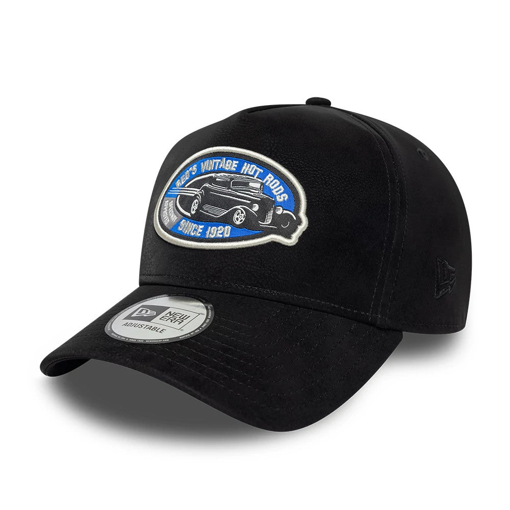 New Era Moto Patch PU Black New Era 9FORTY E-Frame Adjustable Cap, three-quarter view showing a vintage hot rods embroidered patch in blue and white on the front panel, with a curved black visor and a 9FORTY size sticker on the visor.