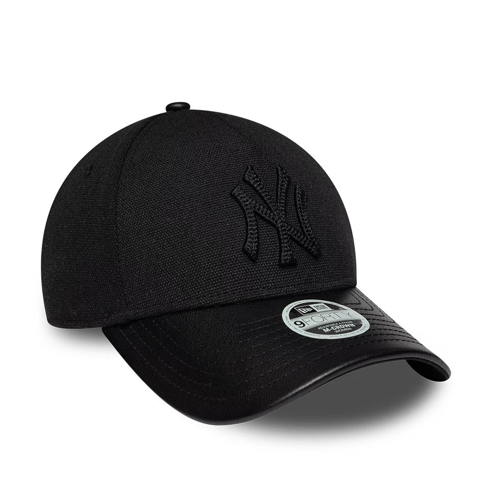 Yankees Womens MLB Fabric Mix Black New Era 9FORTY M-Crown A-Frame Adjustable Cap, three-quarter view showing the raised black embroidered NY logo on the front panel, a curved black visor, and a 9FORTY size sticker on the top of the visor.