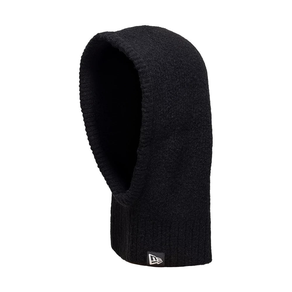 New Era Slouch Black Balaclava Hat, three-quarter view with a soft textured fabric showing the ribbed edge, an extended hood shape, and the New Era flag logo positioned near the bottom front edge.