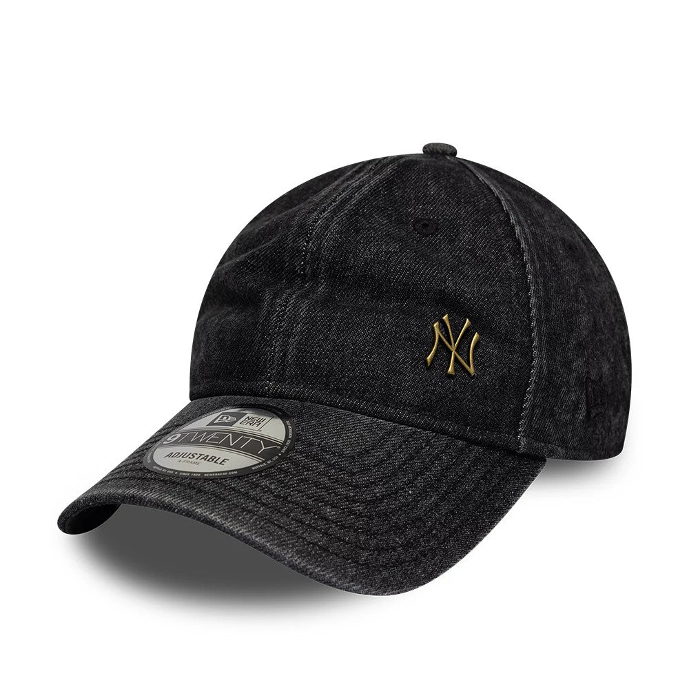 New York Yankees MLB Washed Denim Black New Era 9TWENTY Adjustable Cap, three-quarter view showing the gold embroidered NY logo on the front panel, curved visor with a 9TWENTY size sticker, and washed black denim fabric.