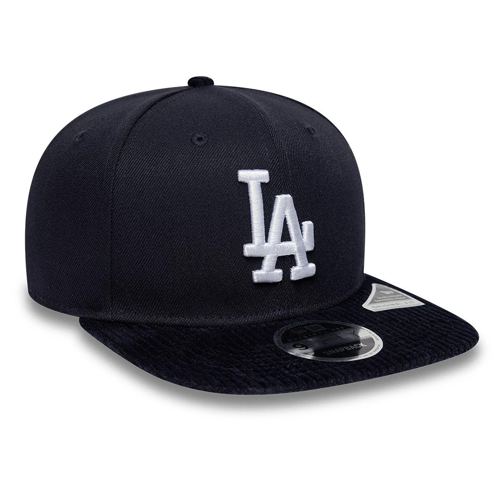 Dodgers MLB Cord Visor Navy New Era 9FIFTY Original Fit Snapback Adjustable Cap, three-quarter view showing the raised white embroidered LA logo on the navy front panel, a unique corduroy-patterned navy visor, and the 9FIFTY size sticker.