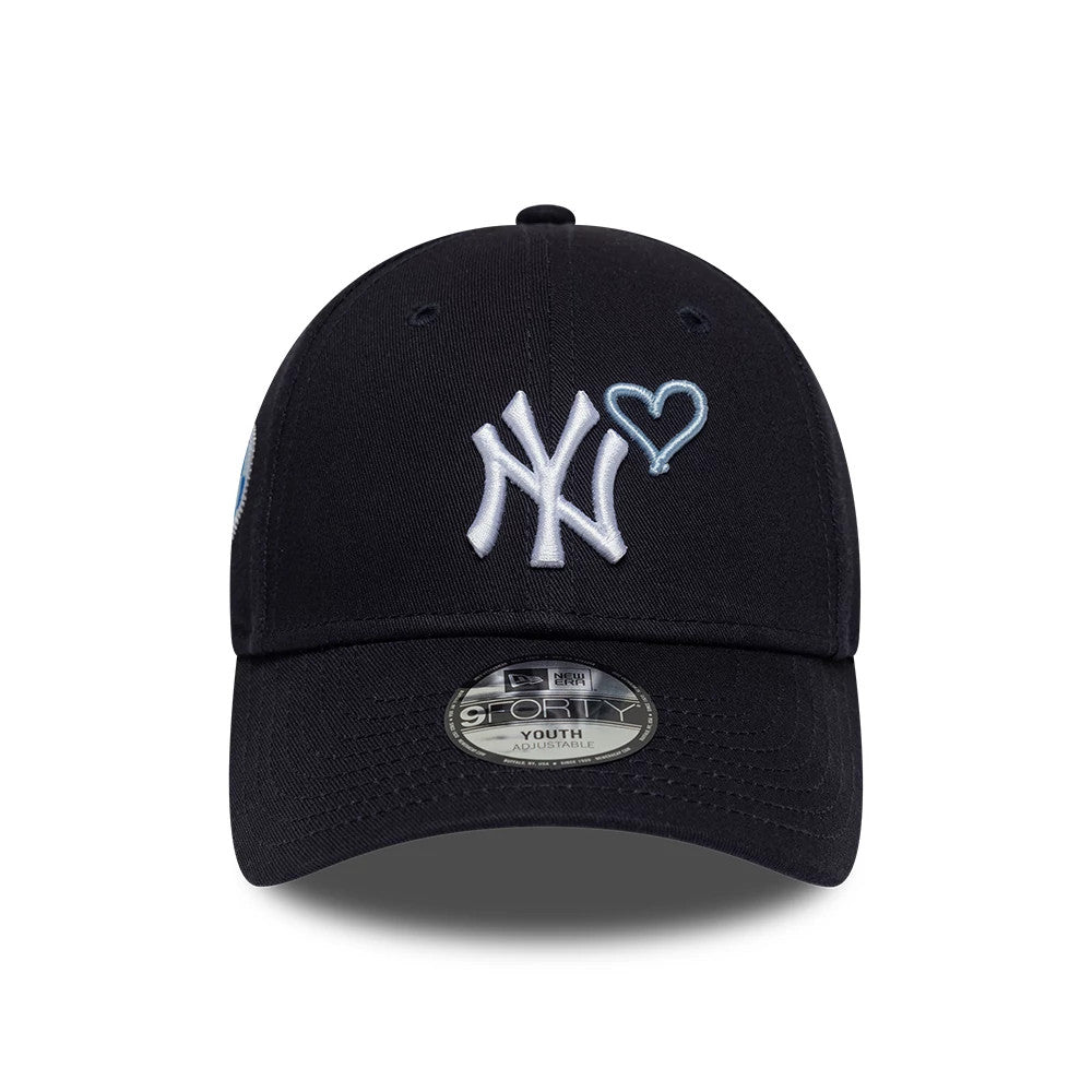 New York Yankees Youth MLB Heart Icon Navy New Era 9FORTY Adjustable Cap, front view showing the raised embroidered white NY logo with a light blue heart icon on the structured navy crown, complemented by a 9FORTY size sticker on the curved visor.