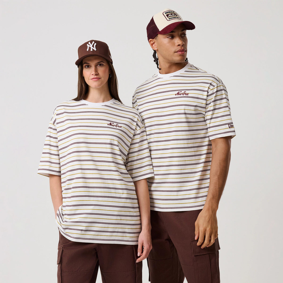 The model is wearing this New Era Stripe T-Shirt in white. 1