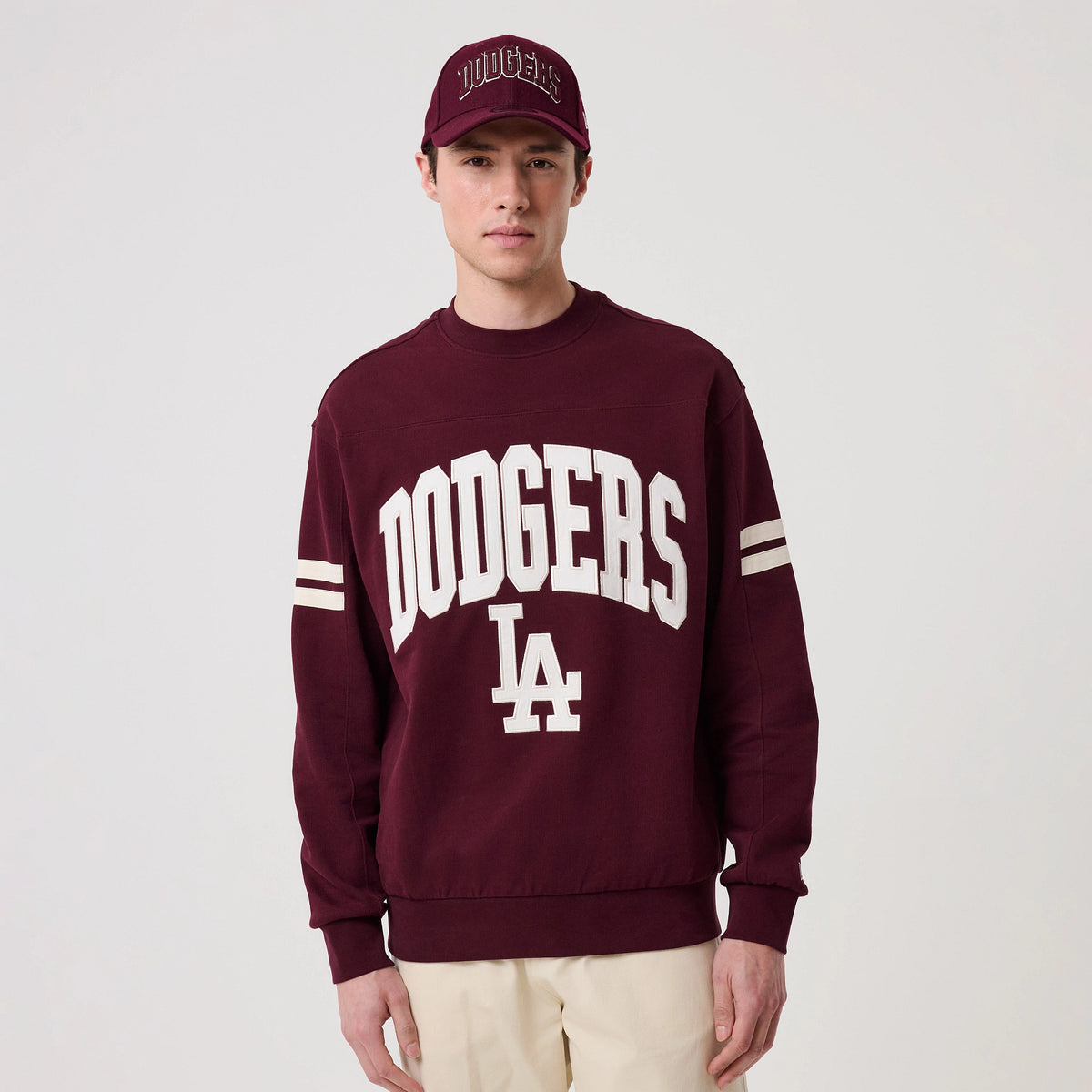The model is wearing this MLB Arch Graphic LA Dodgers Crew Neck Sweater in dark purple. 3