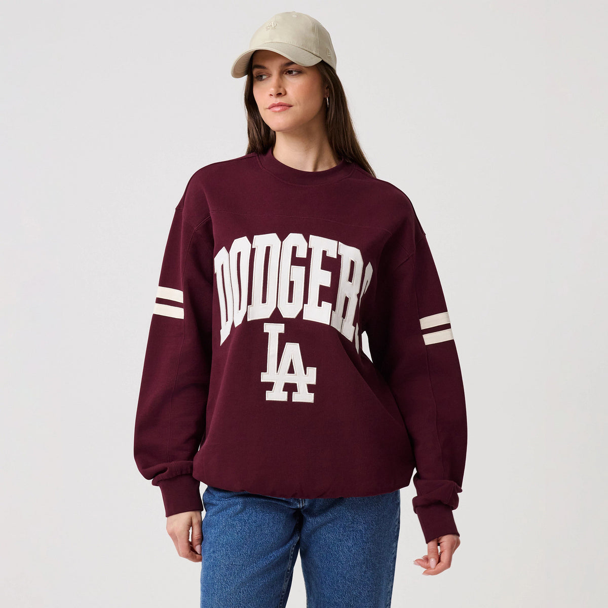 The model is wearing this MLB Arch Graphic LA Dodgers Crew Neck Sweater in dark purple. 4