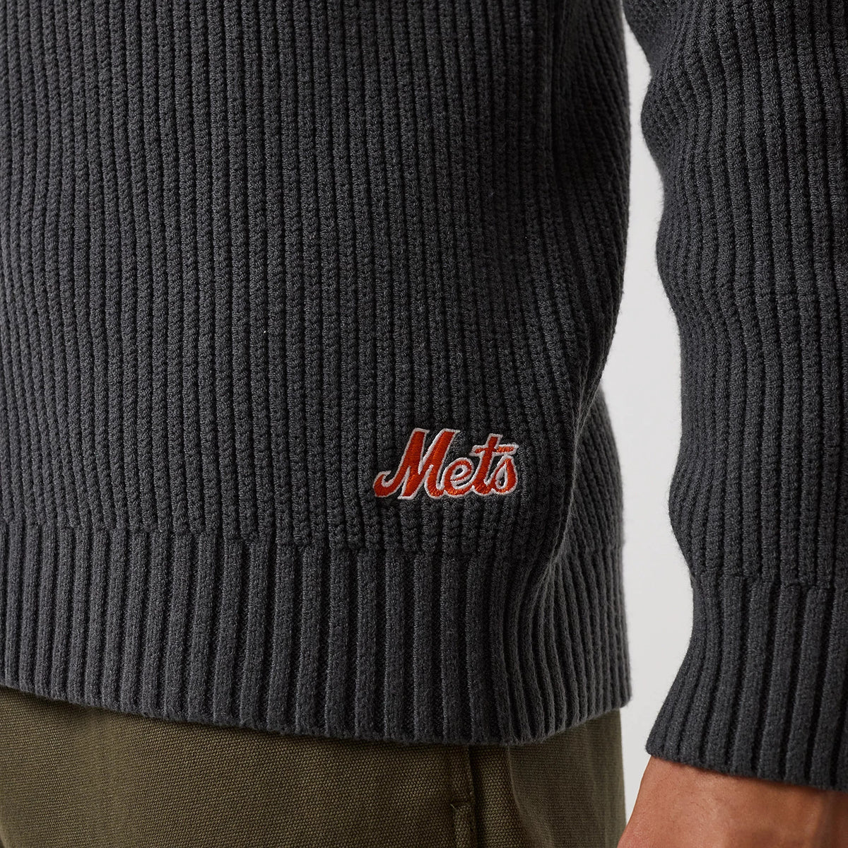 The model is wearing this MLB New York Mets 2 Way Zip Cardigan in charcoal. 8