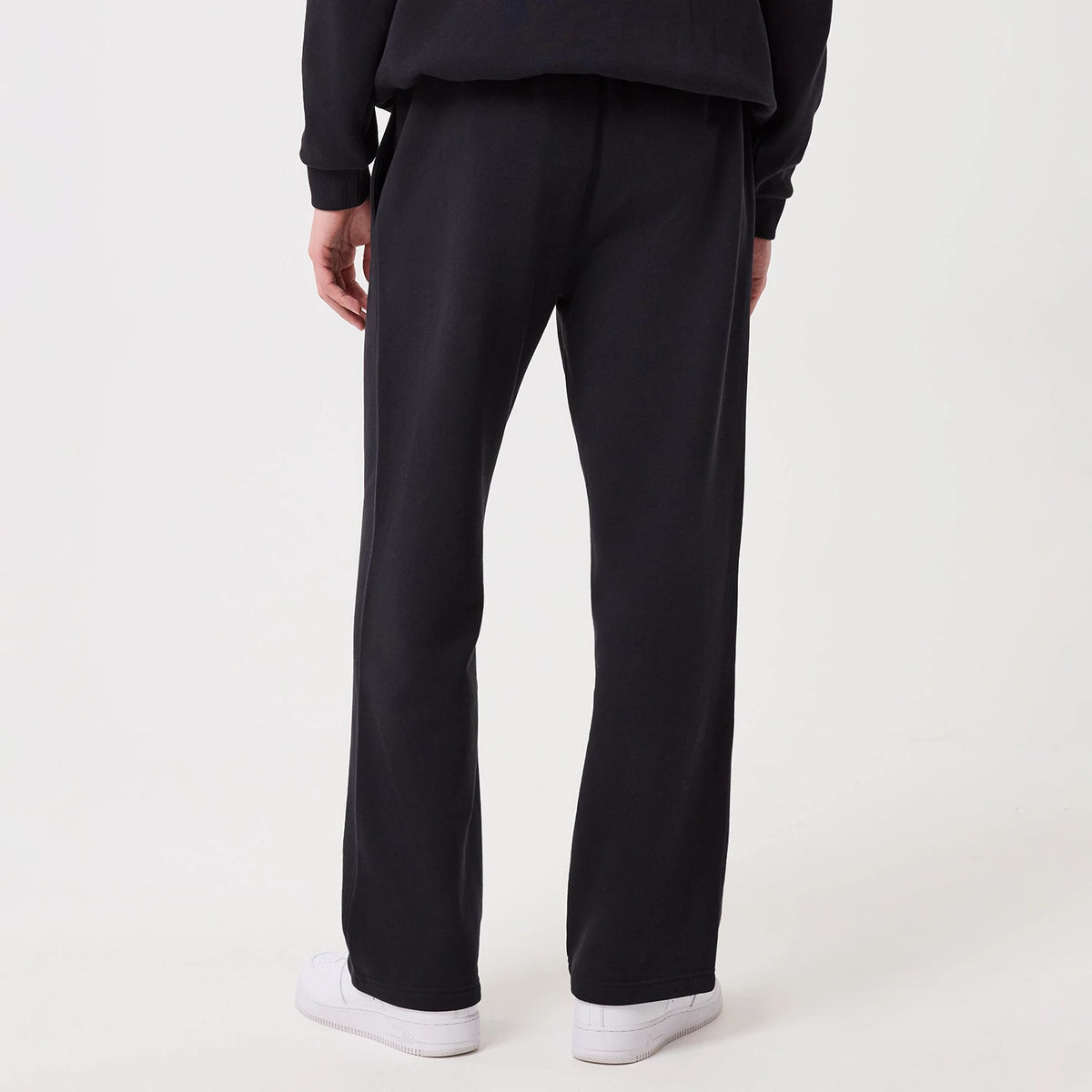 The model is wearing this New Era Straight Leg Joggers in navy. 2
