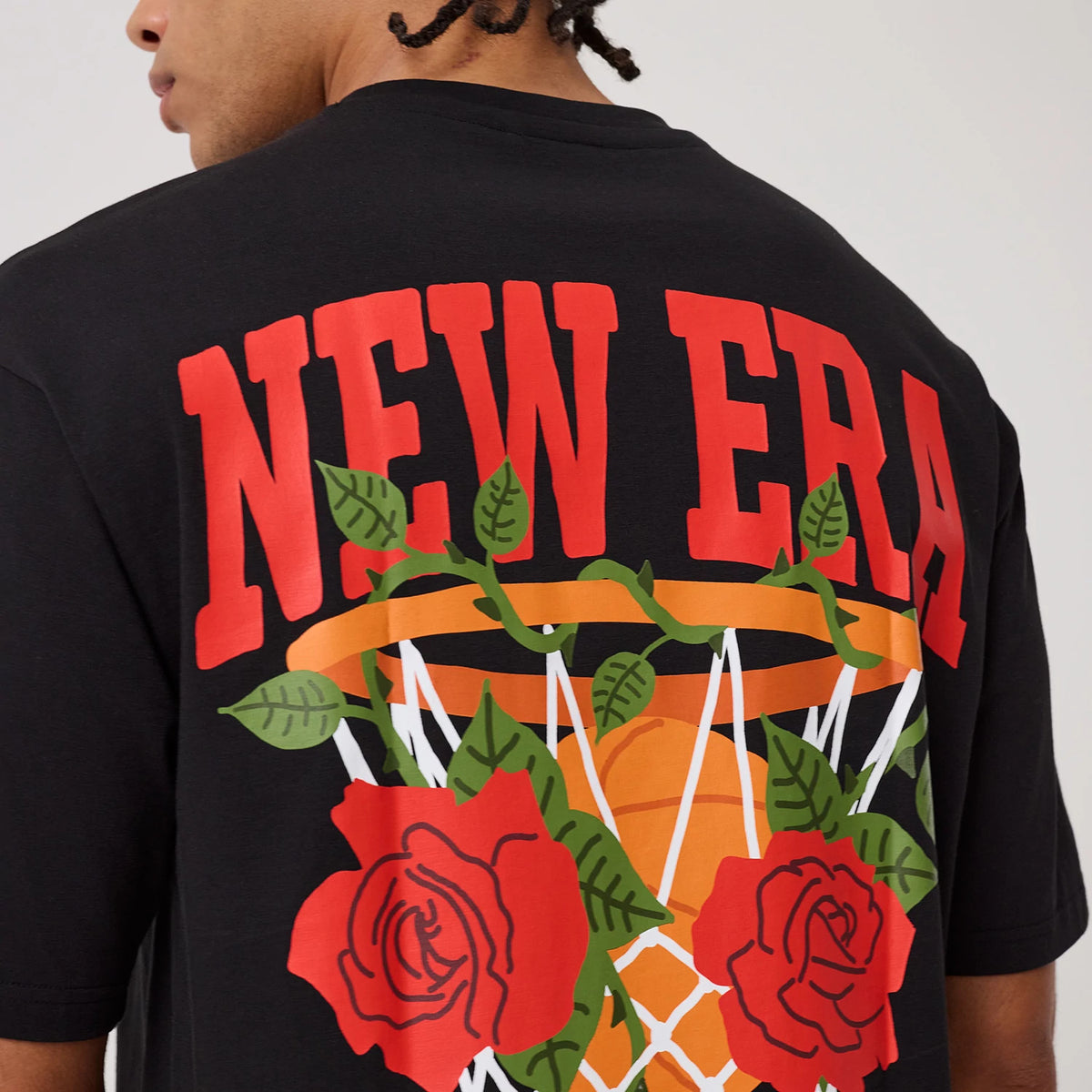The model is wearing this New Era Floral Graphic T-Shirt in black. 8