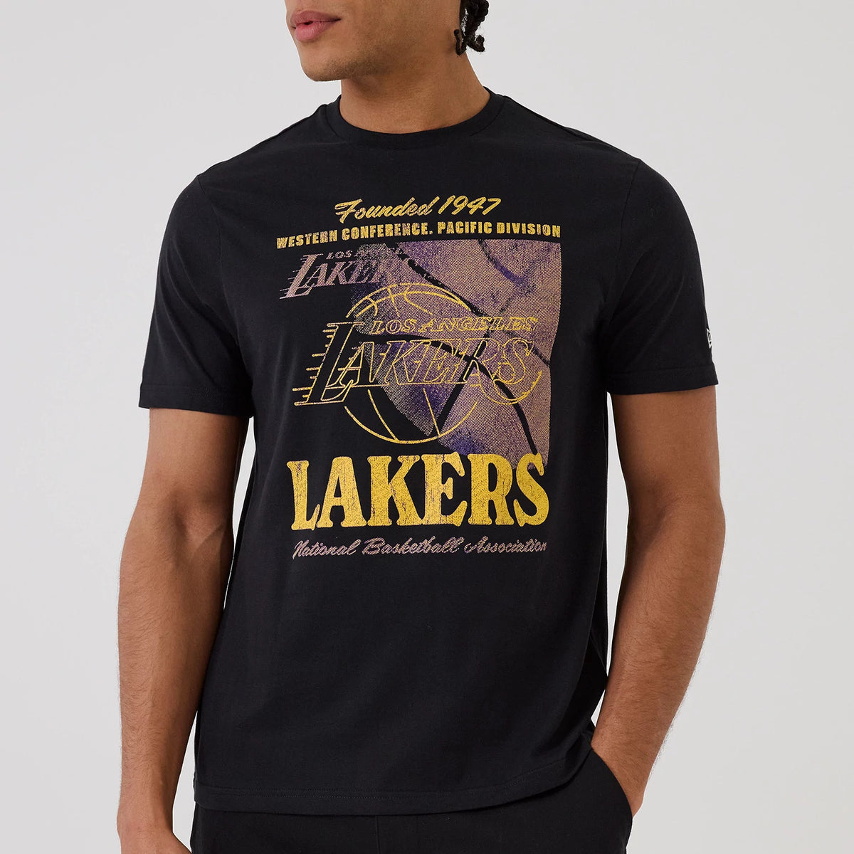 New Era LA Lakers NBA Graphic Black T-Shirt, front view showing large distressed LA Lakers logo in purple and gold across the chest with additional text reading Founded 1947 and Western Conference, Pacific Division.