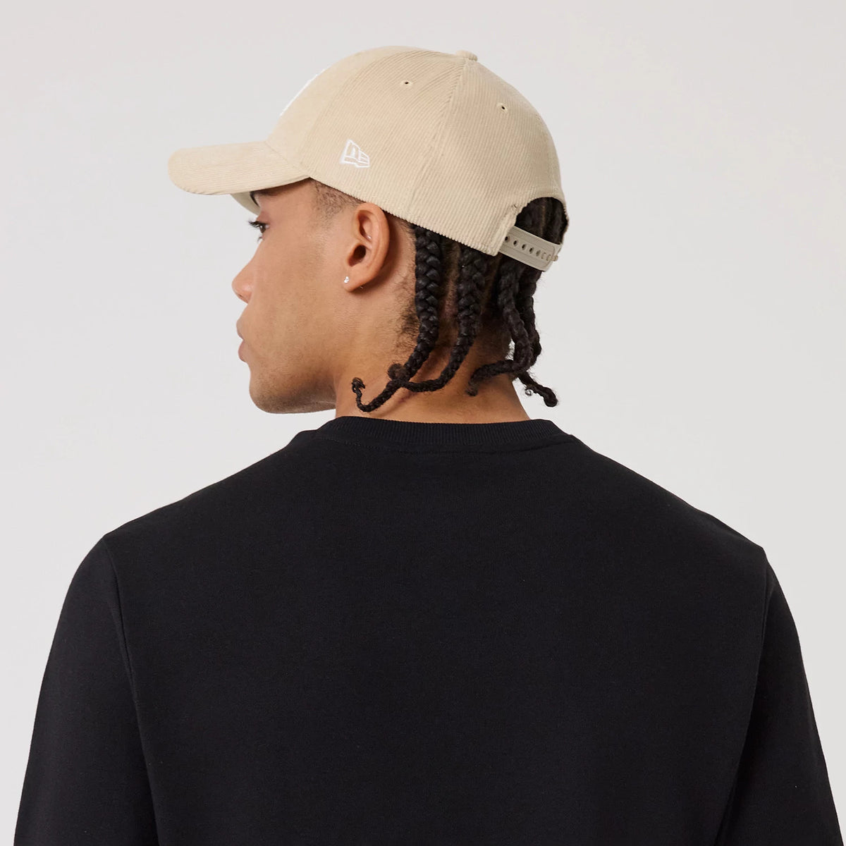 The model is wearing this MLB Linear New York Yankees Crew Neck Sweater in black. 8