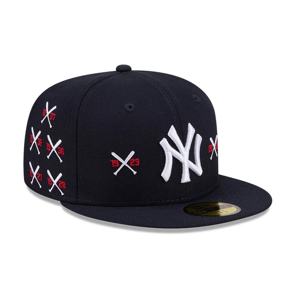 Yankees MLB X Spike Lee Crossed Bats Navy New Era 59FIFTY Fitted Cap, front view with a raised white NY logo embroidered on the front panel, crossed bats with red years on the side, and a gold 59FIFTY size sticker on the flat navy visor.