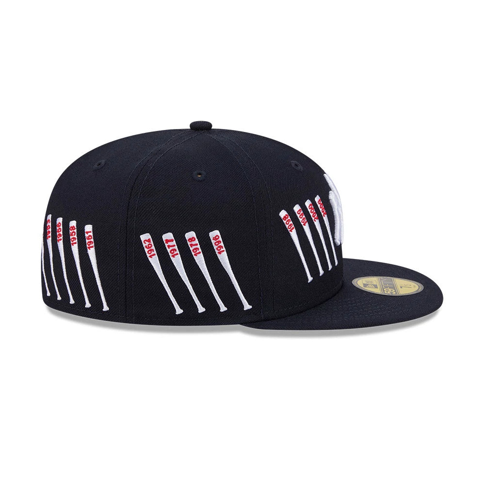 Yankees MLB X Spike Lee Baseball Bats Navy New Era 59FIFTY Fitted Cap, side view showing the white embroidered baseball bats with red year on the navy structured crown, and a gold 59FIFTY size sticker on the flat navy visor.