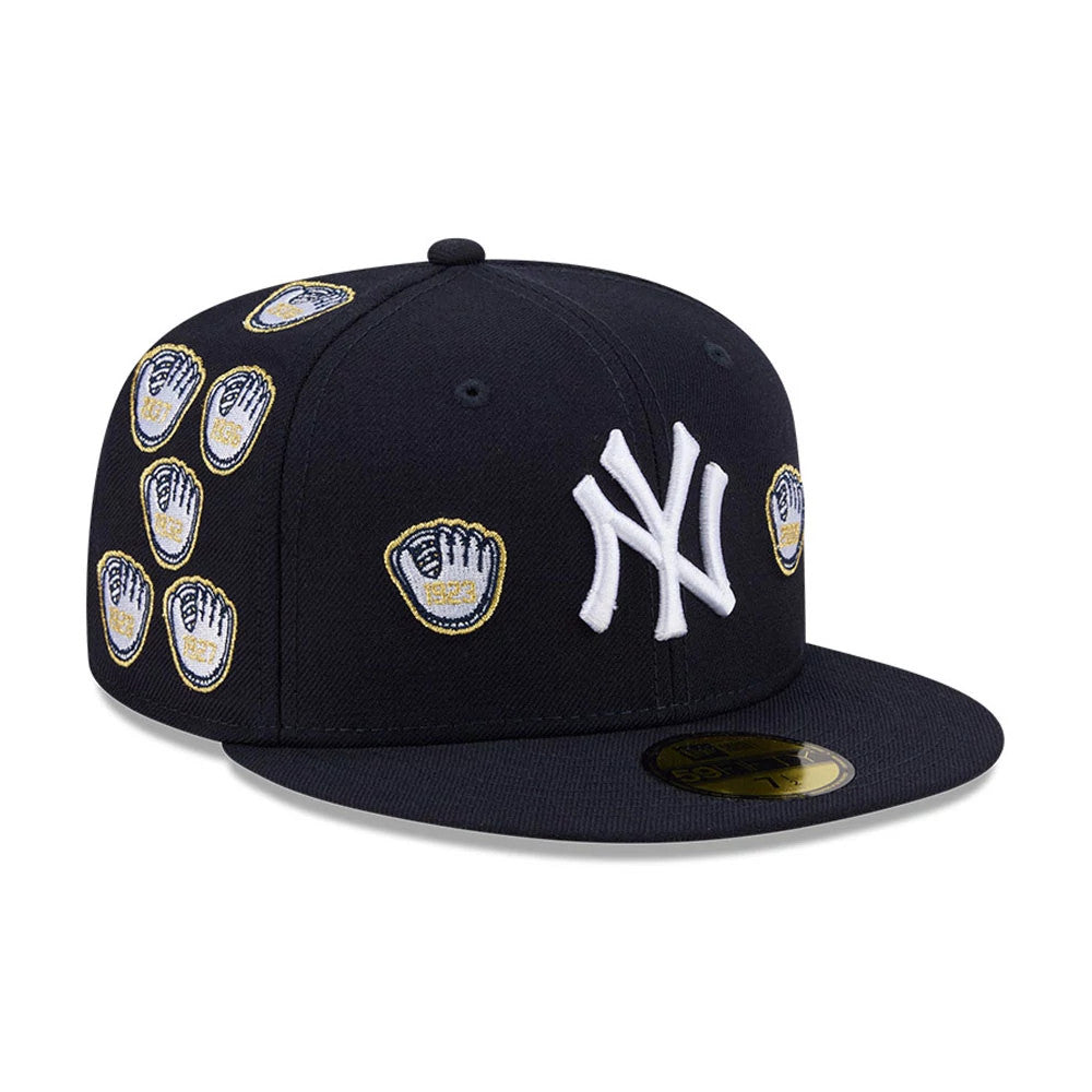 New York Yankees MLB X Spike Lee Gloves Navy New Era 59FIFTY Fitted Cap, three-quarter view showing the white raised NY logo on the front, multiple embroidered glove graphics on side panels, and a gold 59FIFTY size sticker on the flat navy visor.