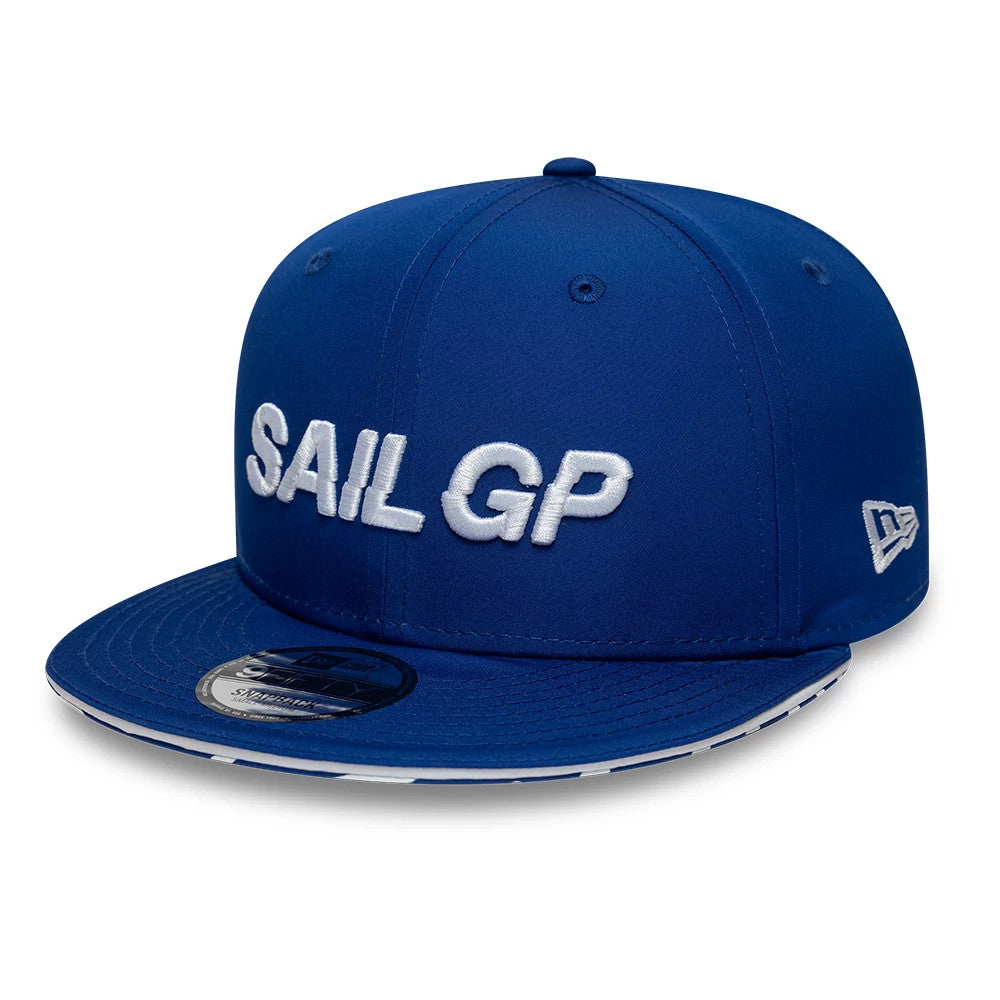 Sail GP Limited Blue New Era 9FIFTY Snapback Adjustable Cap, front view showing white raised embroidered SAIL GP logo on the front panels, with a flat blue visor and a 9FIFTY size sticker on the visor's centre.