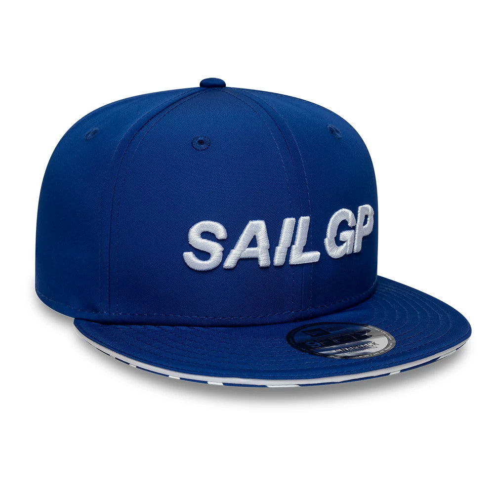 Sail GP Limited Blue New Era 9FIFTY Snapback Adjustable Cap, front view showing the raised embroidered white SAIL GP lettering on the structured blue crown, with a flat blue visor and a black 9FIFTY size sticker on the visor.