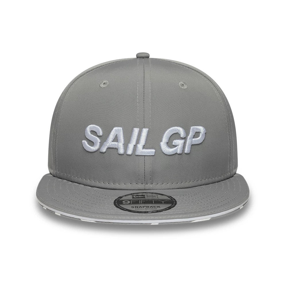 Sail GP Limited Grey New Era 9FIFTY Snapback Adjustable Cap, front view showing the white embroidered Sail GP lettering on the structured grey crown, with a flat grey visor and a 9FIFTY size sticker centrally placed.