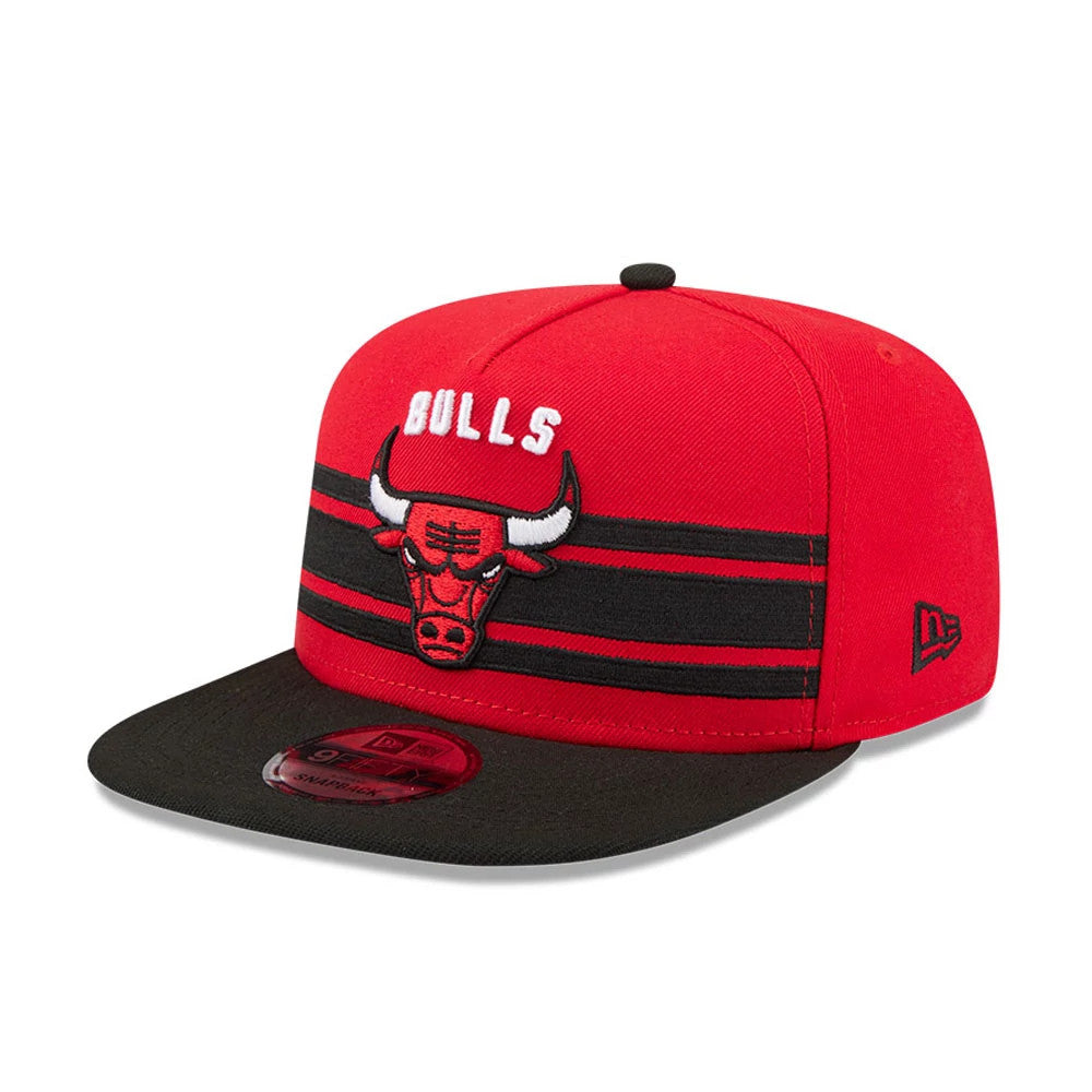 Chicago Bulls NBA Tip Off 2026 Red New Era 9FIFTY A-Frame Snapback Adjustable Cap, front view showing the raised, embroidered Bulls logo with horns and text on the red crown, featuring a black visor and a 9FIFTY size sticker on top.