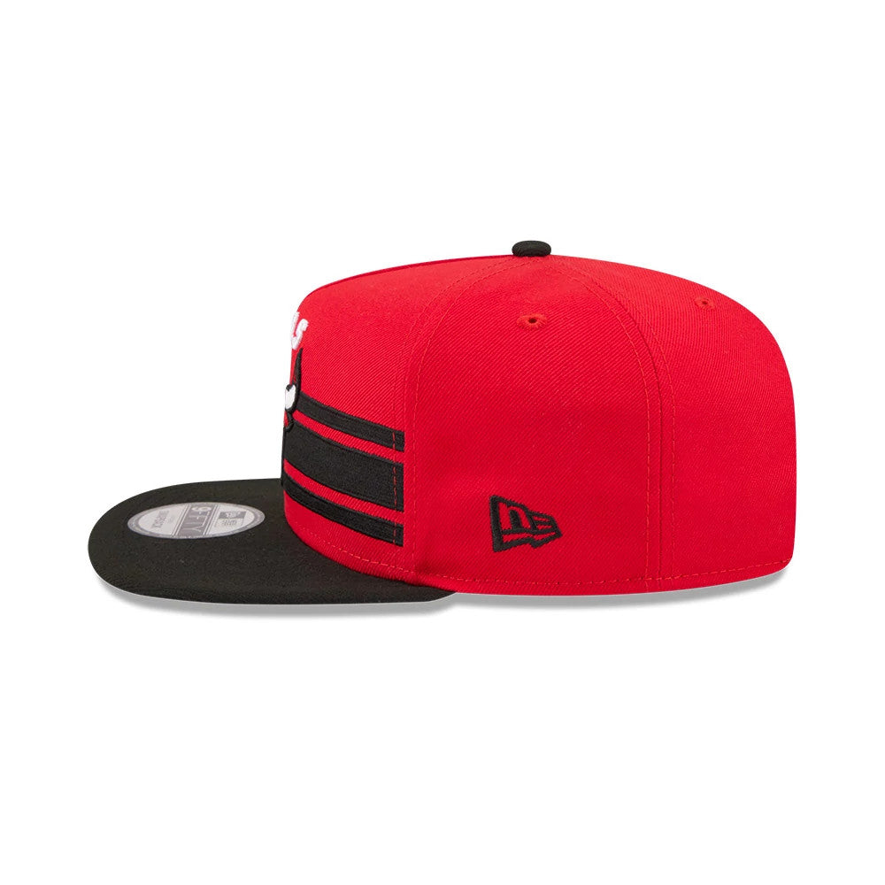 Chicago Bulls NBA Tip Off 2026 Red New Era 9FIFTY A-Frame Snapback Adjustable Cap, side view showing the black New Era flag logo on the left side, black flat visor with a 9FIFTY size sticker, and a structured red crown.