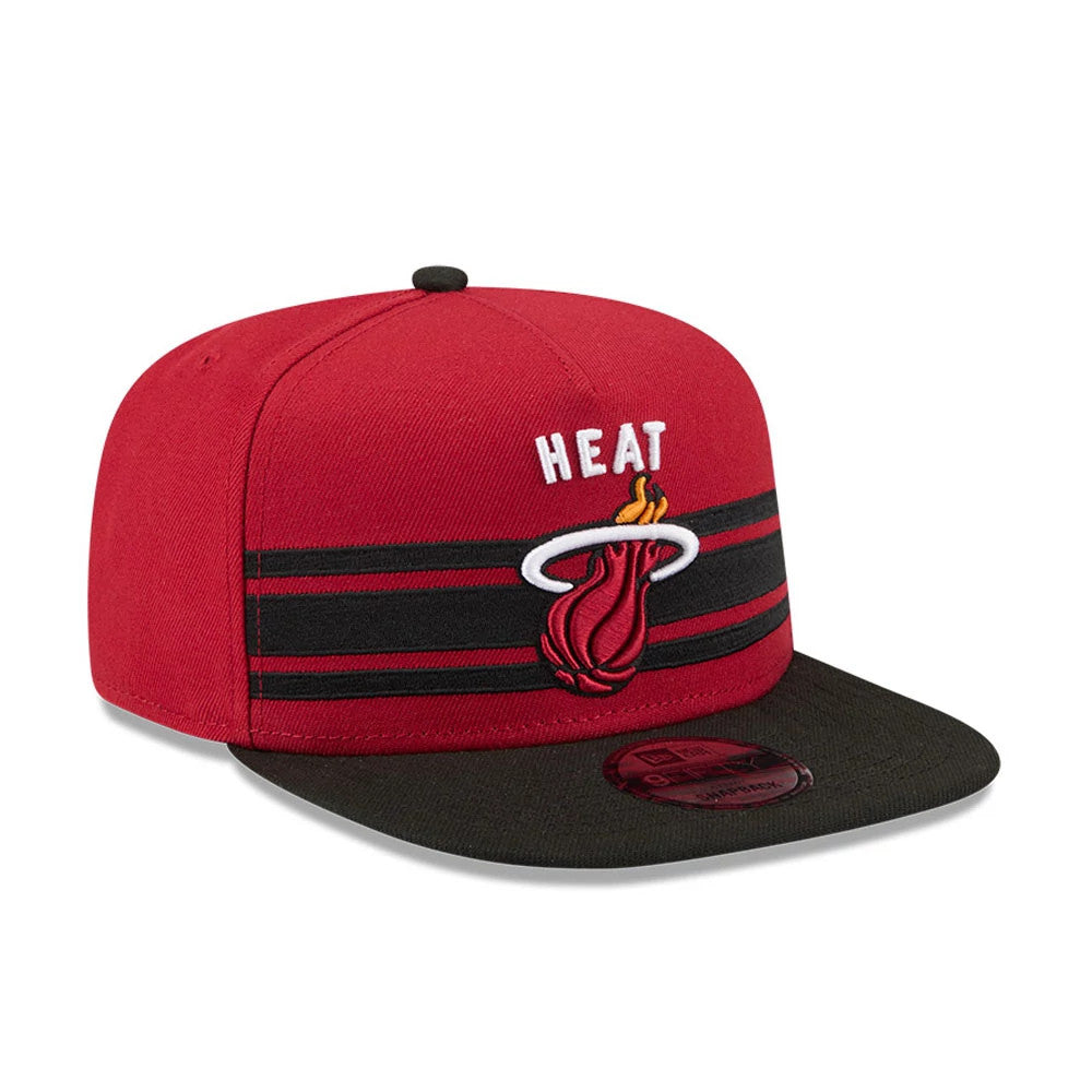 Miami Heat NBA Tip Off 2026 Dark Red New Era 9FIFTY A-Frame Snapback Adjustable Cap, front view showing the Heat logo with fireball embroidery on the dark red crown, a black flat visor, and a black and red striped band above the visor.
