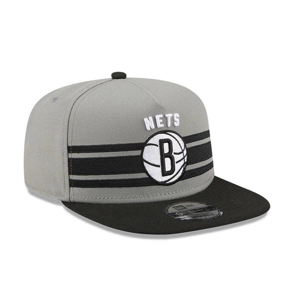 Brooklyn Nets NBA Tip Off 2026 Dark Grey New Era 9FIFTY A-Frame Snapback Adjustable Cap, front view showing raised white embroidered Nets and black B basketball logo on grey crown, with a black visor and a 9FIFTY size sticker.