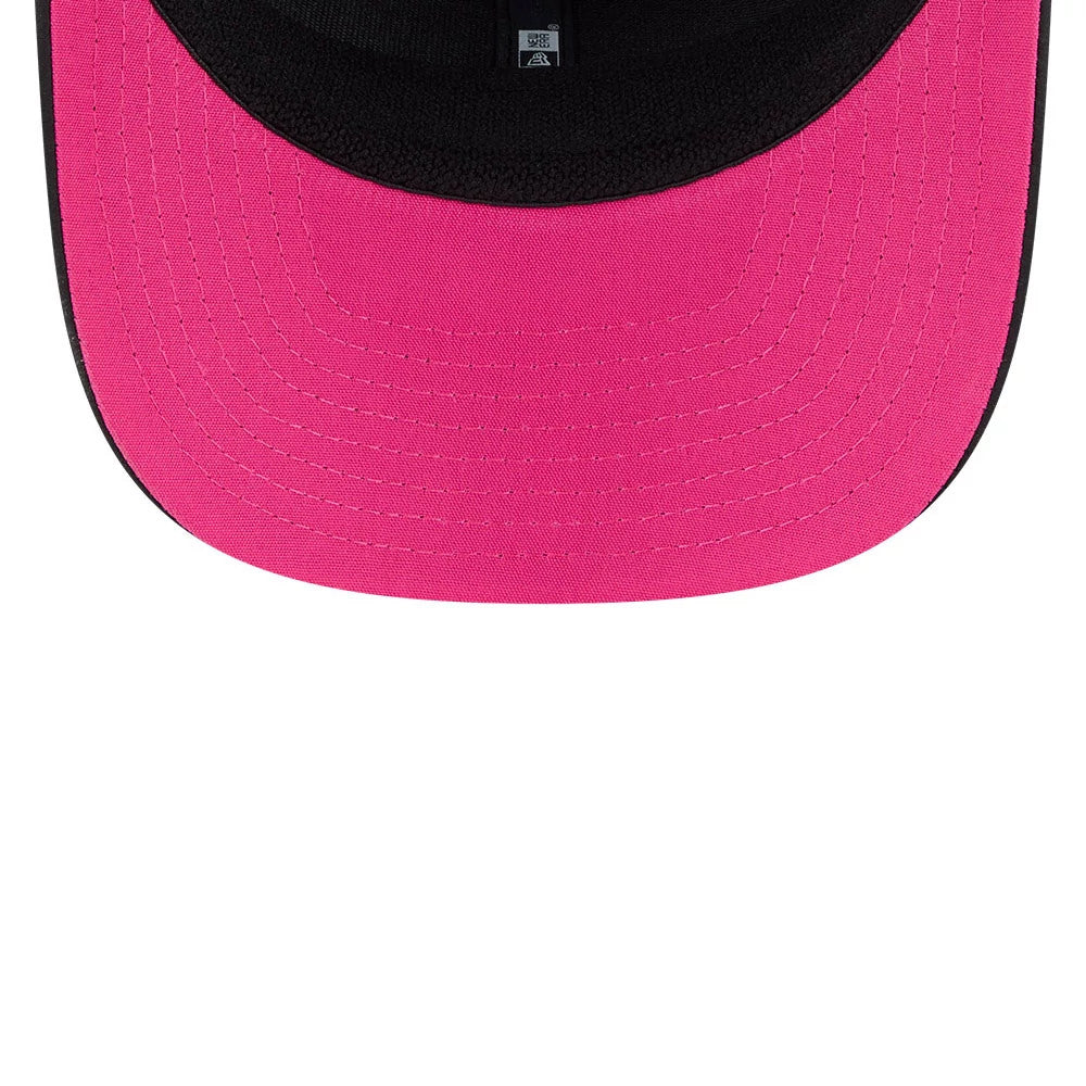Eagles NFL City Connect 2026 Black New Era 9SEVENTY Stretch Snap Adjustable Cap, inside view showing a pink undervisor beneath a black sweatband, with black interior taping beneath the cap’s structured crown.
