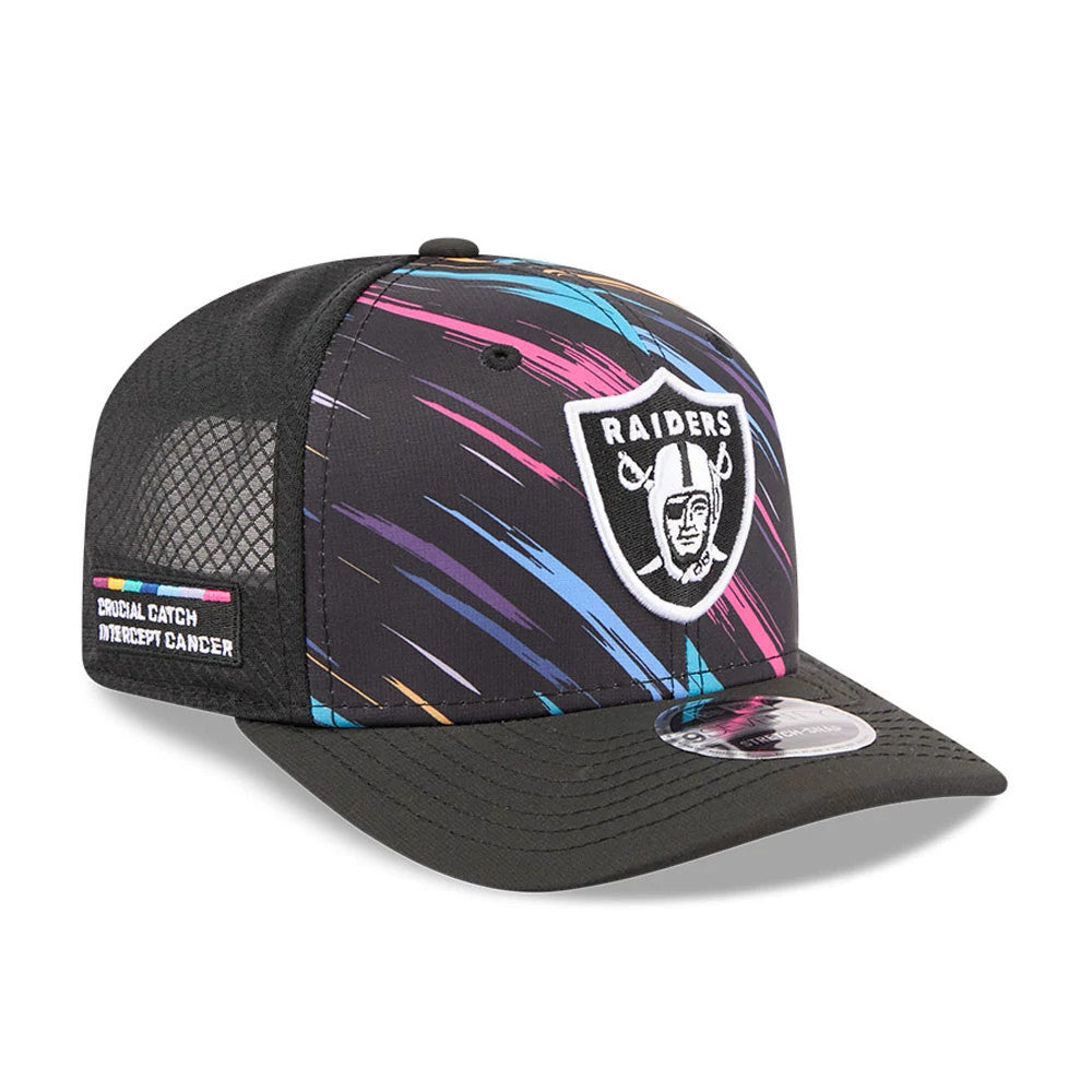 Raiders NFL City Connect 2026 Black New Era 9SEVENTY Stretch Snap Adjustable Cap, three-quarter view showing the embroidered Raiders logo on a colourful brushstroke pattern, black mesh side panel with a Crucial Catch patch.