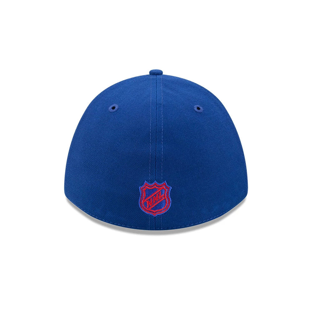 New York Rangers NHL Team Blue New Era 39THIRTY M-Crown Stretch Fit Cap, rear view showing the red embroidered NHL logo shield at the centre of the back panels, with blue eyelets and a matching top button on the structured blue crown.